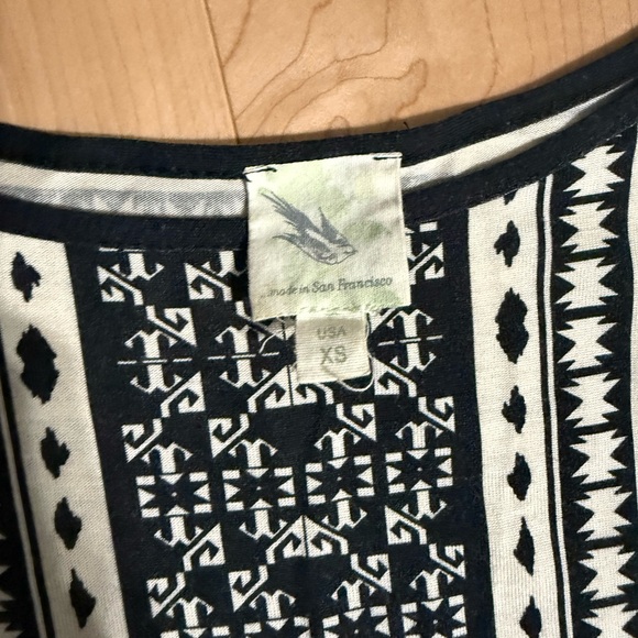 Quarter sleeve black and tan printed shirt with peplum detail on bottom. - Picture 2 of 2